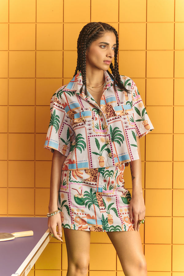 Crop shirt with bold statement buttons with short skirt