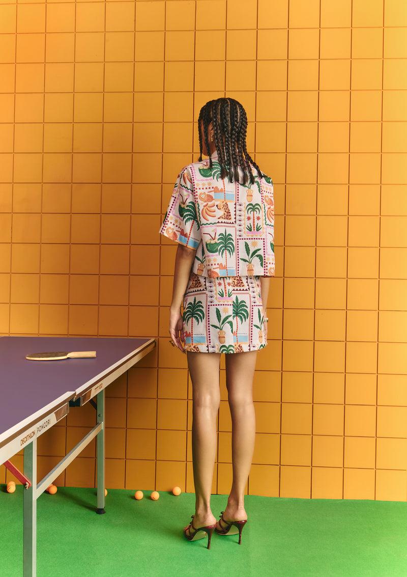 Crop shirt with bold statement buttons with short skirt