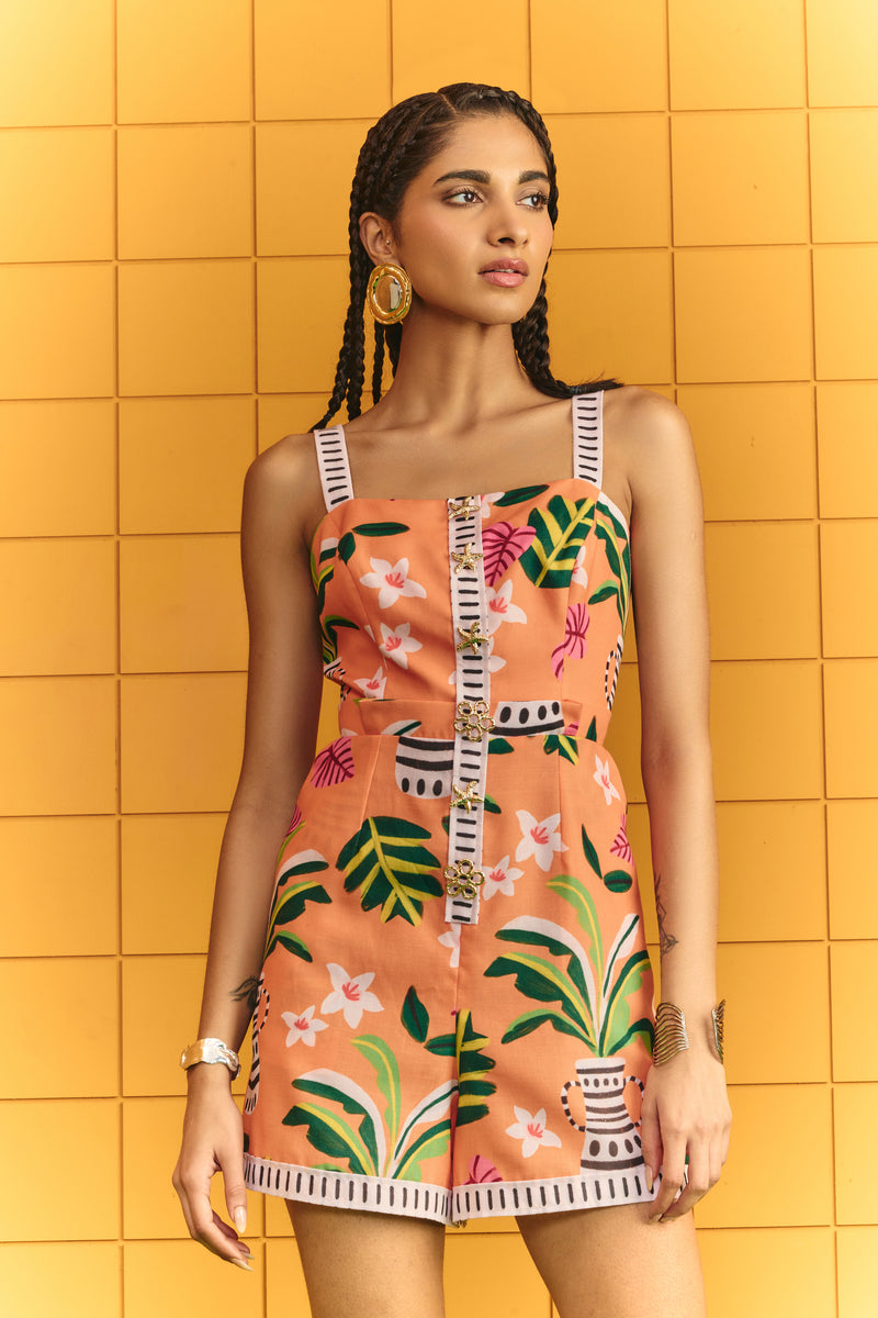 Strap short jumpsuit with bold statement buttons