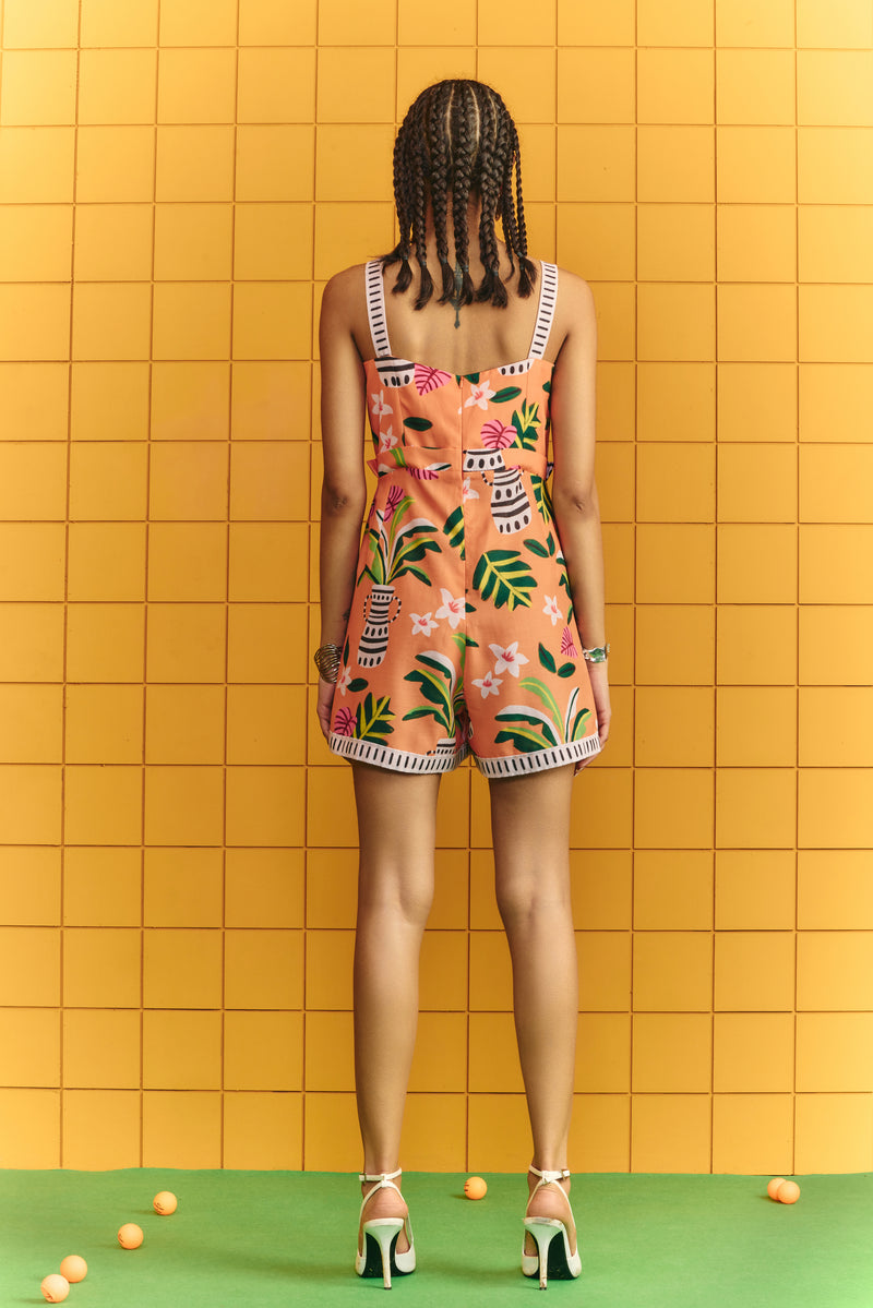 Strap short jumpsuit with bold statement buttons