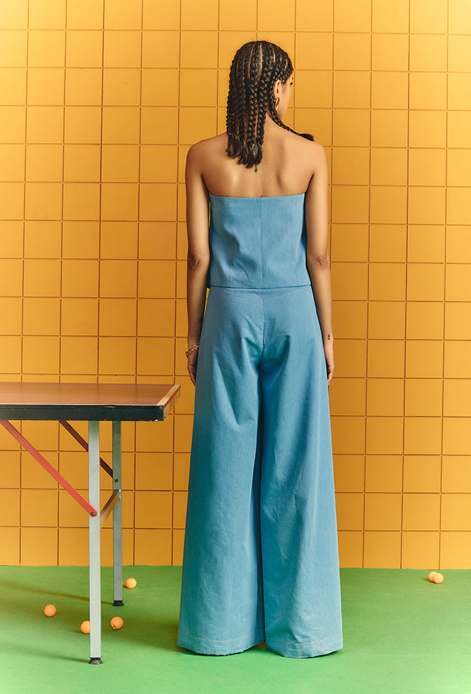 Light blue tube denim with bold buttons with flare pants